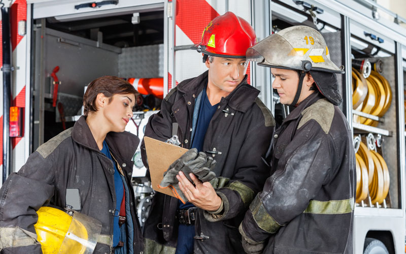 A group of firefighters planning before responding to an incident